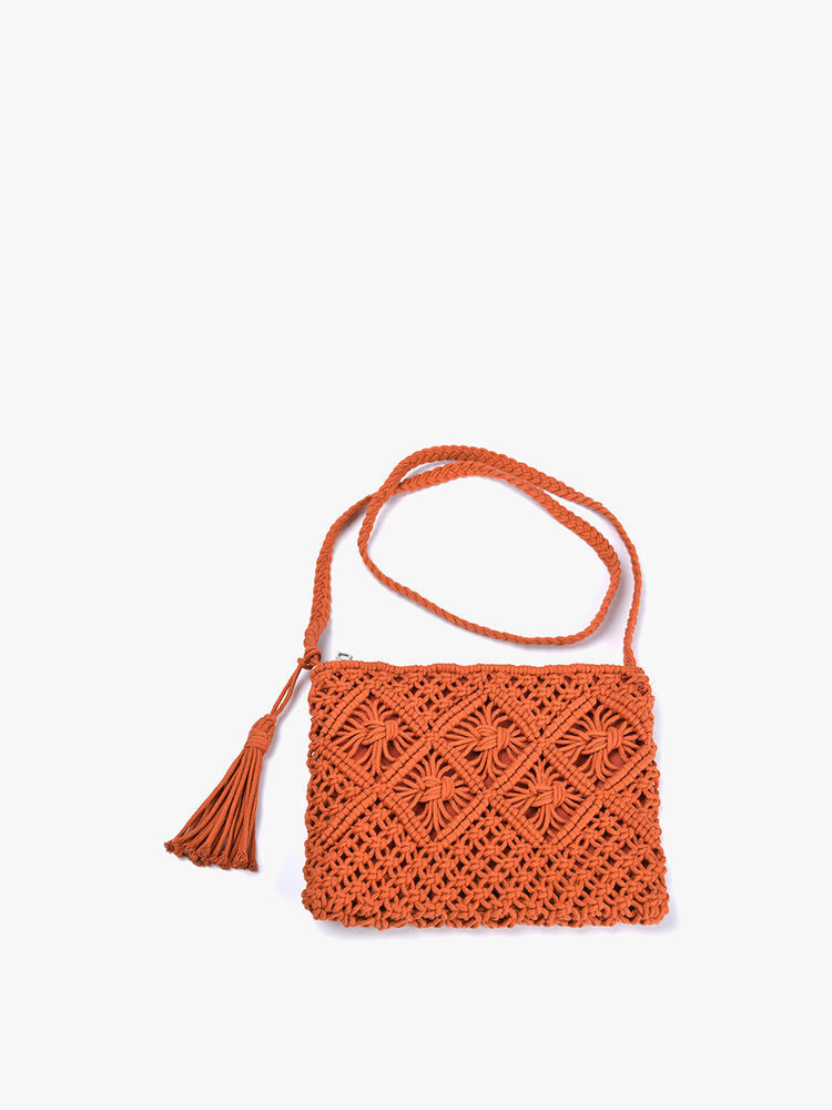dark orange macrame purse on a white background.