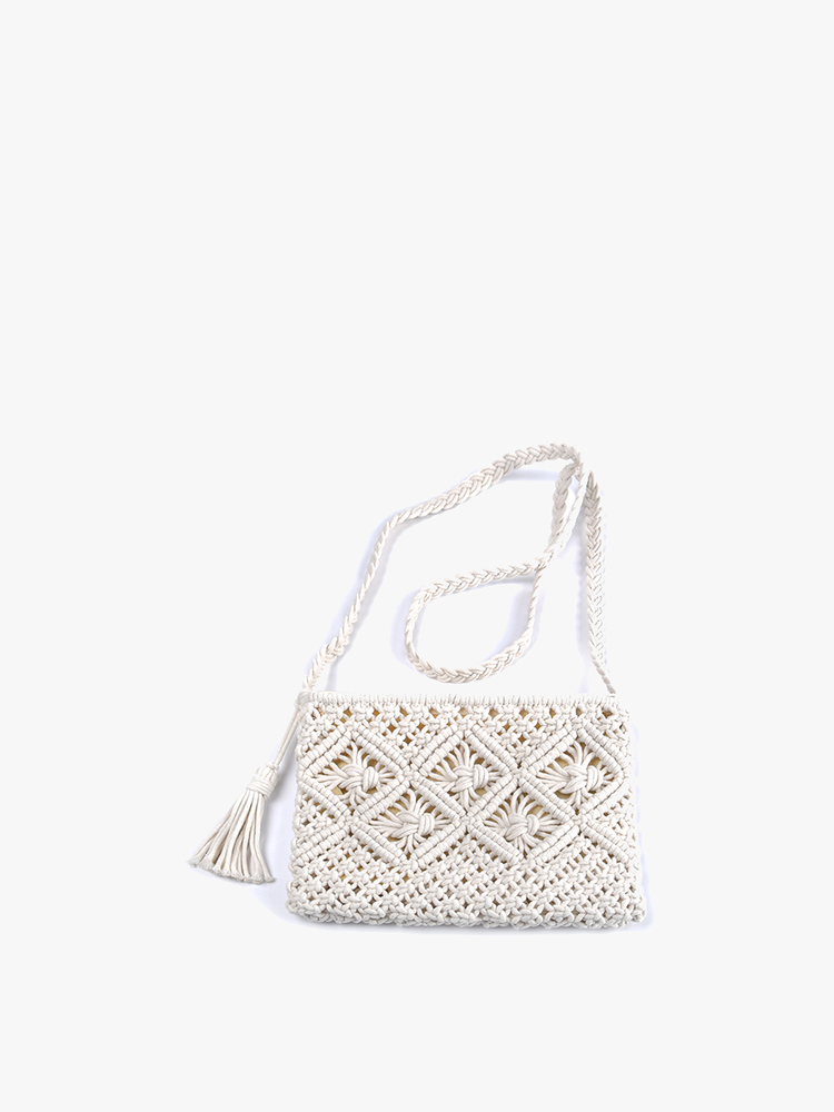 off-white macrame purse on a white background.