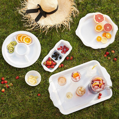 large melamine platters and serving trays with fruit displayed on the grass