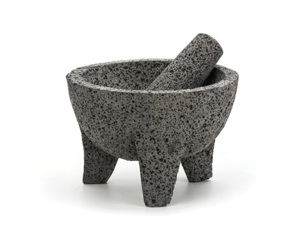 Molcajete and tejolote on white background.