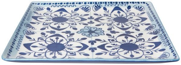 angled view of the white and blue porto stamped square plate