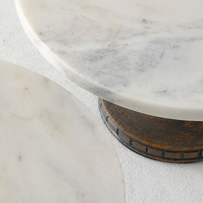 top view of two marble-topped pedestals with wooden bases.