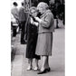 front of card has old black and white photo of two older women looking at a cell phone