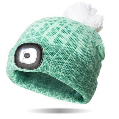 green geometric patterned beanie hat with white pom on top and LED light in the cuff.