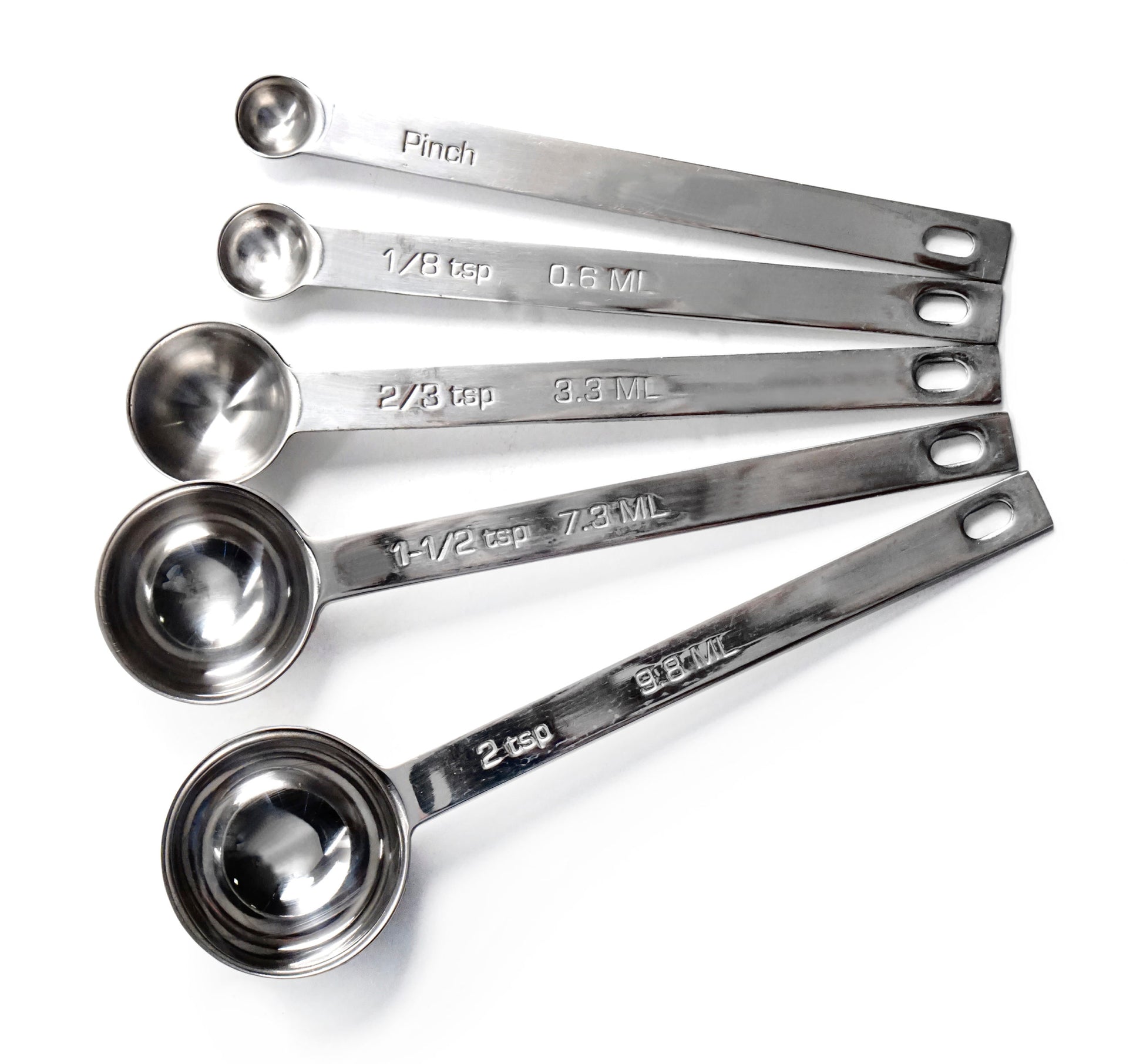 set of 5 stainless steel measuring spoons on white background.