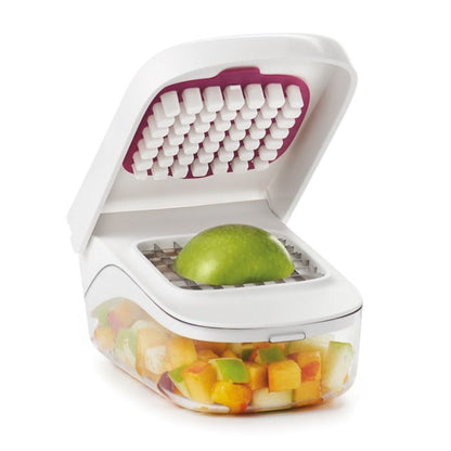 chopper with apple on it and chopped fruit in base.