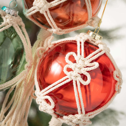 close-up of red ball with macrame on it.