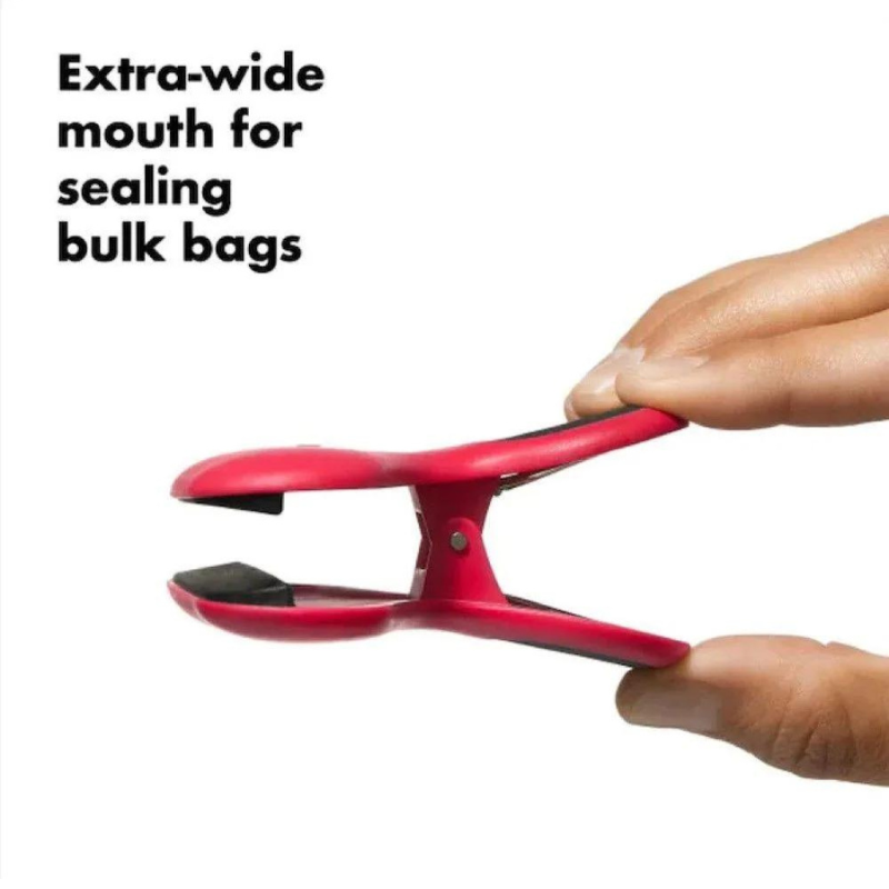 side view of red clip with text "extra wide mouth for sealing bulk bags."