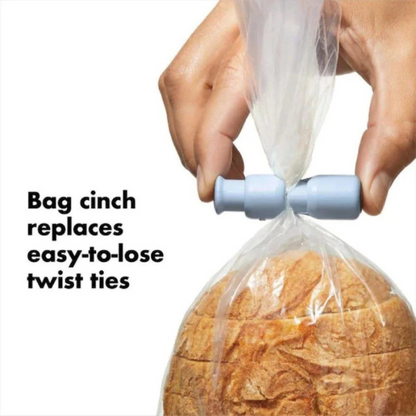 hand holding a bag of sliced bread with a blue clip and text "bag cinch replaces easy-to-lose twist ties.