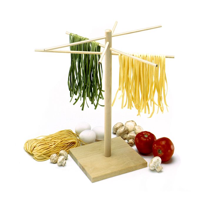 wooden pasta drying rack with pasta on it.