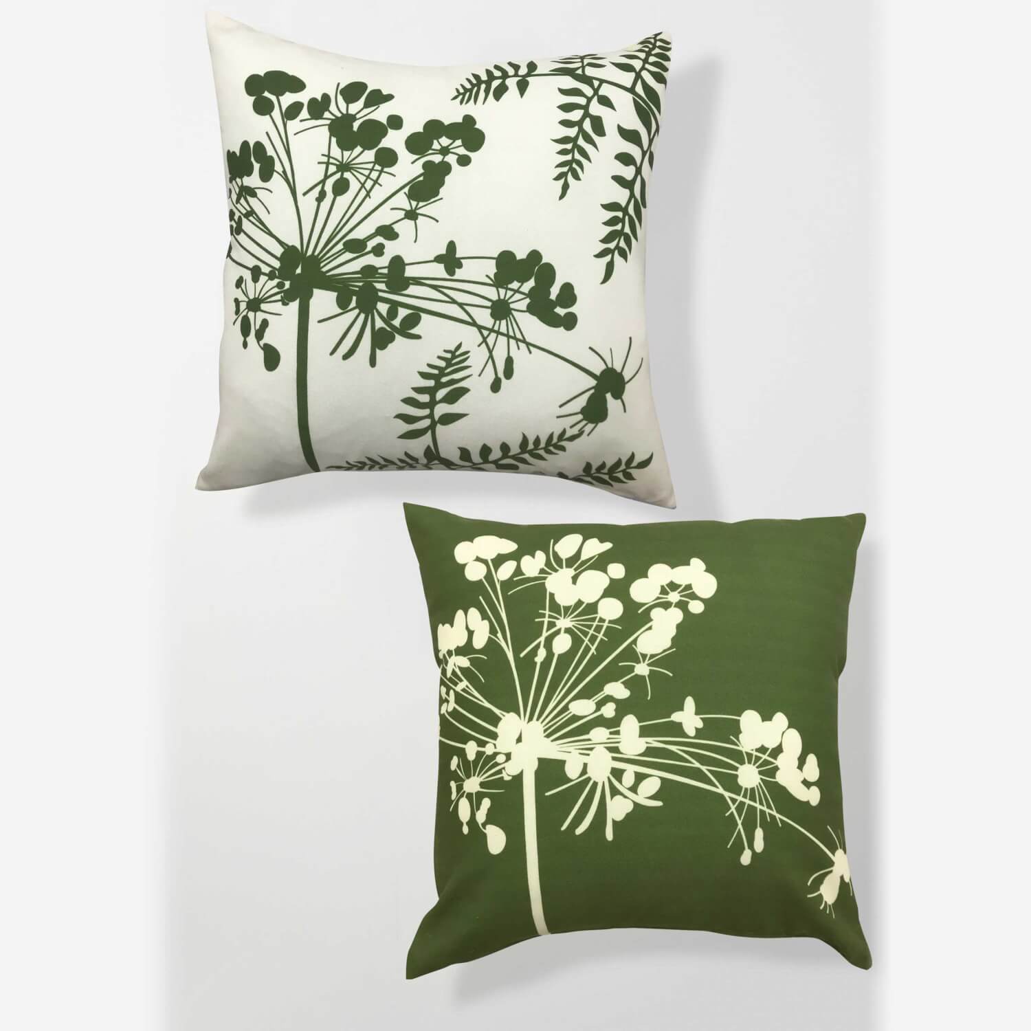 both styles of floral pillows on a white background