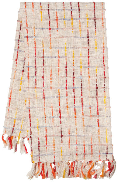 off-white folded blanket with colorful threads and fringe.