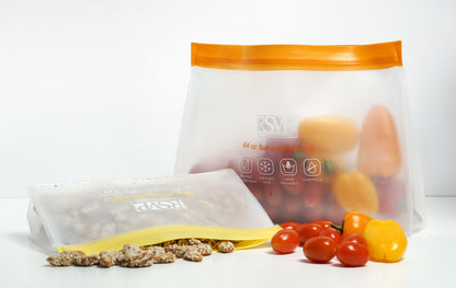 large storage bag filled with small tomatoes and small bag filled with nuts.