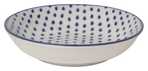 side view of dish with blue dots on the interior and a blue rim.