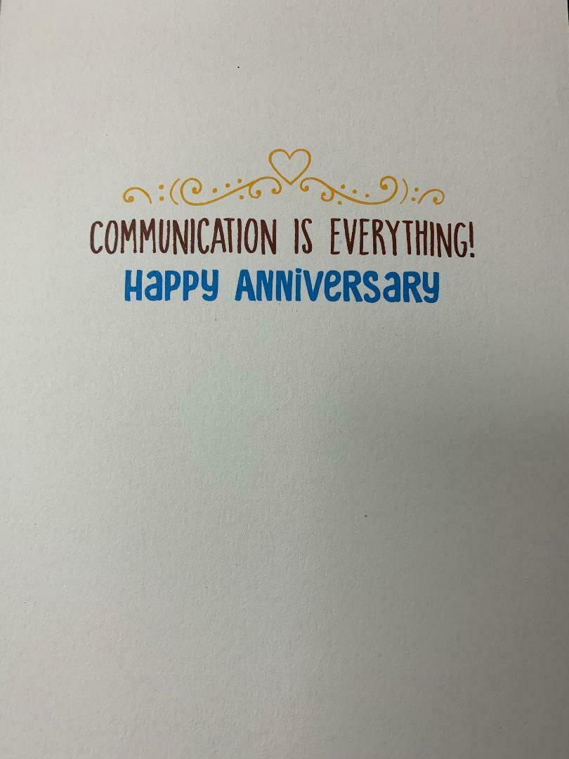 inside of card is white with inside text in brown and blue with a scroll and heart design
