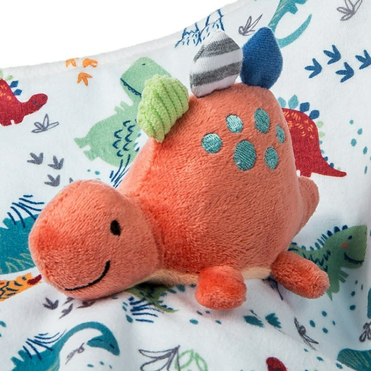 close up view of the orange pebblesaurus lovey