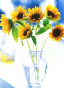 front of card is a photograph of a vase of sunflowers