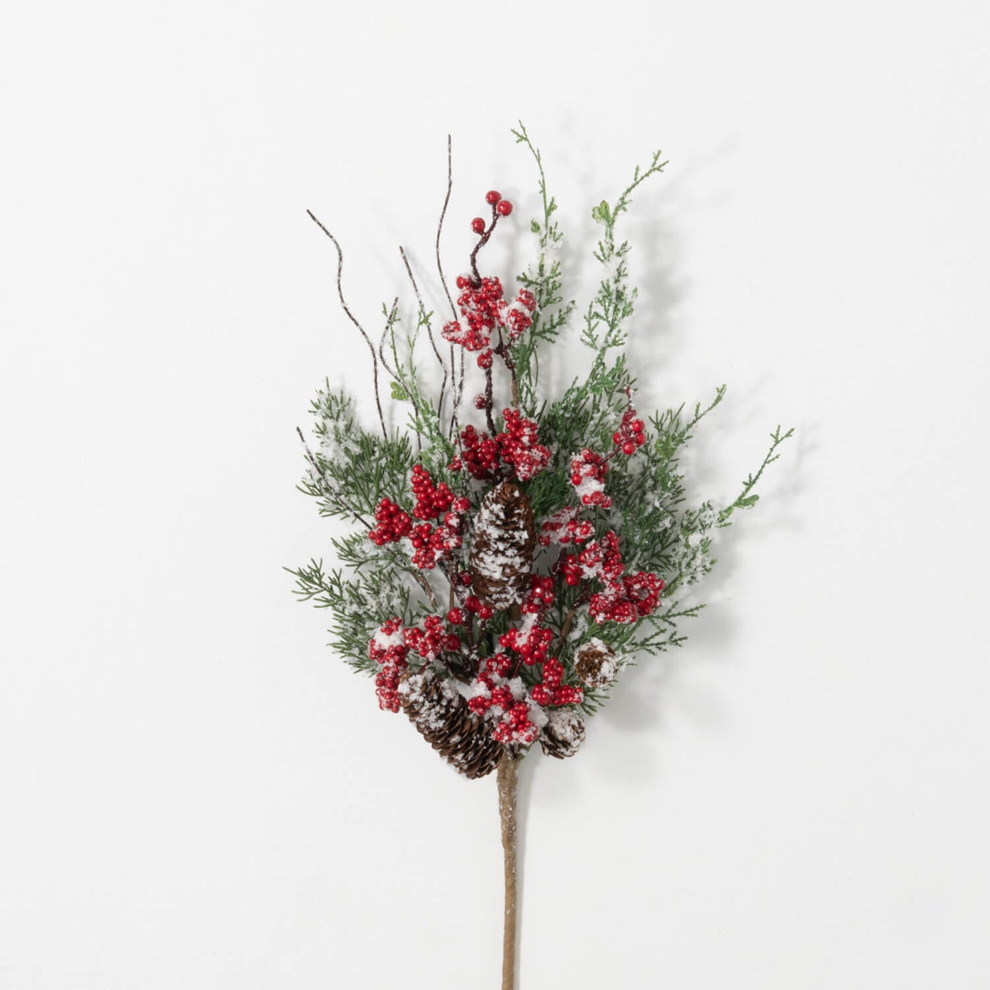 artificial stem with evergreen leaves and branches with red berry clusters and pine cones.