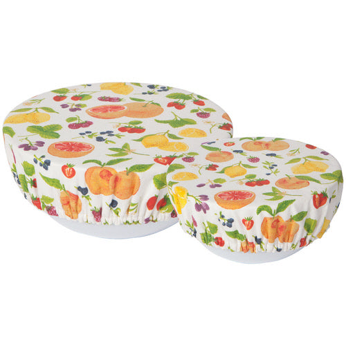 2 sizes of bowl covers with colorful fruit patterns stretched over bowls.