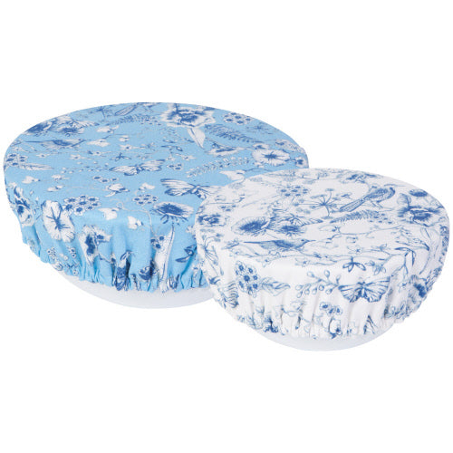 small bowl cover is white with blue flowers and large is blue with white and blue flowers displayed on a white background