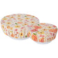 2 sizes if ivory bowl covers with floral patterns on white bowls.