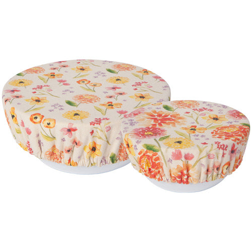 2 sizes if ivory bowl covers with floral patterns on white bowls.