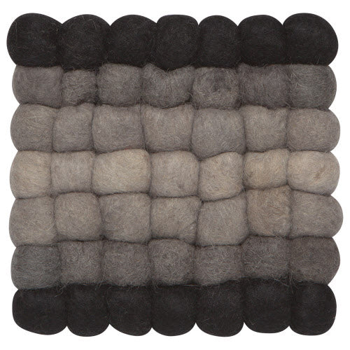 black and grey felted wool balls attached to form a square trivet.