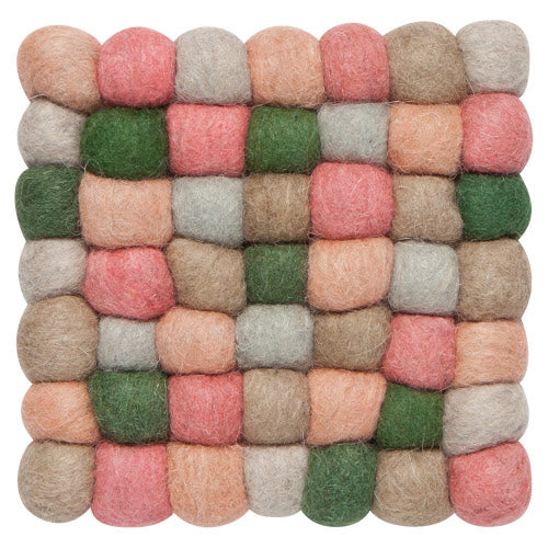 pink, natural, and green felted wool balls attached to form a square trivet.