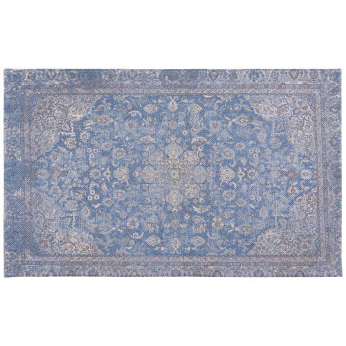 blue print rug with faded pattern.