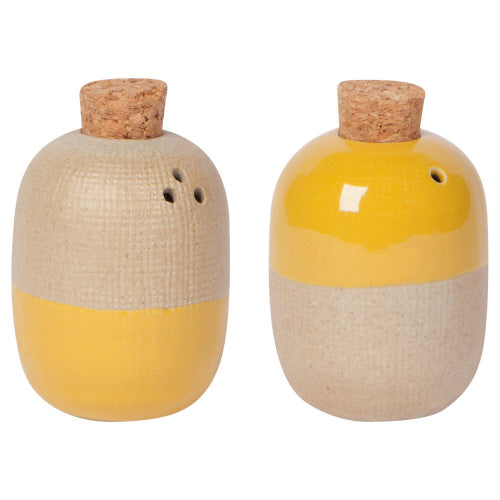 oval shakers with corked openings on top and matte yellow and taupe glaze.