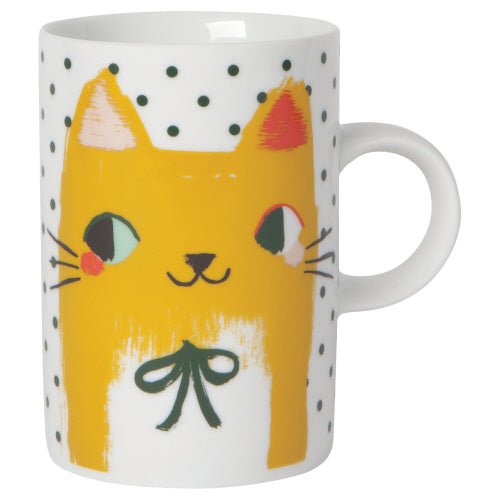 white ceramic mug with yellow smiling cat with bow tie.