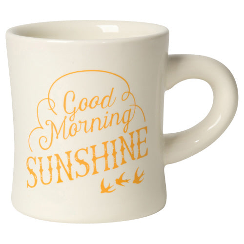 off-white mug with yellow text "good morning sunshine".