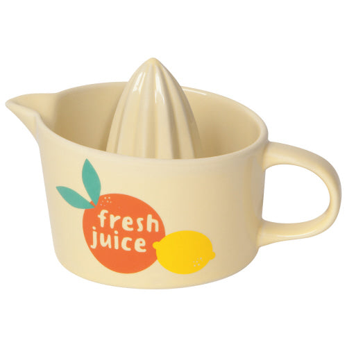 pale yellow juicer with orange and lemon graphic on it.