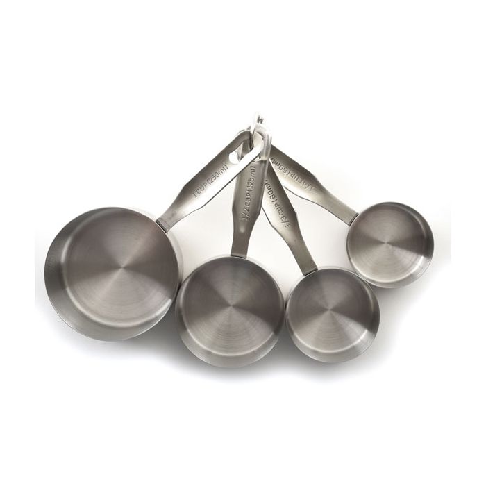 4 Stainless Steel Measuring Cups arranged next to each other and attached at the handle ends by a ring.
