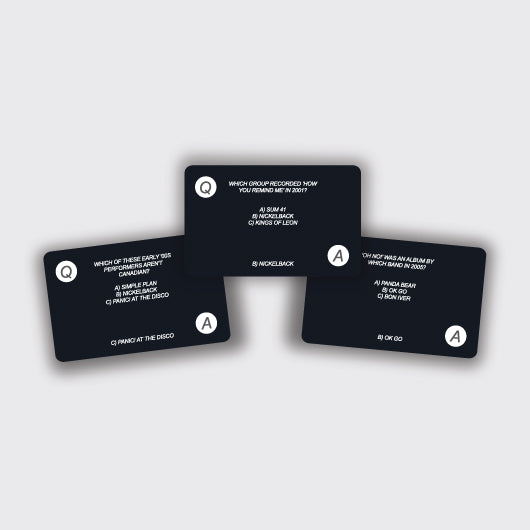 three trivia playing cards on a white background