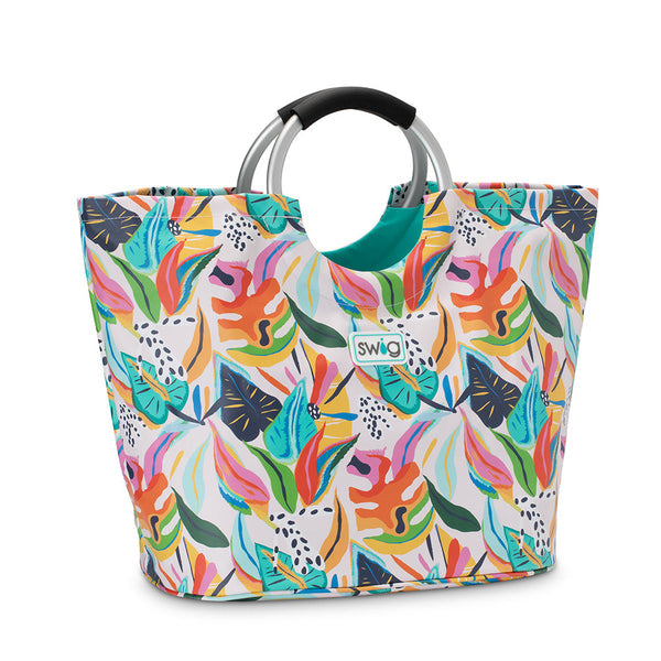 swig loopi tote with bright colored leaf pattern on a white background.