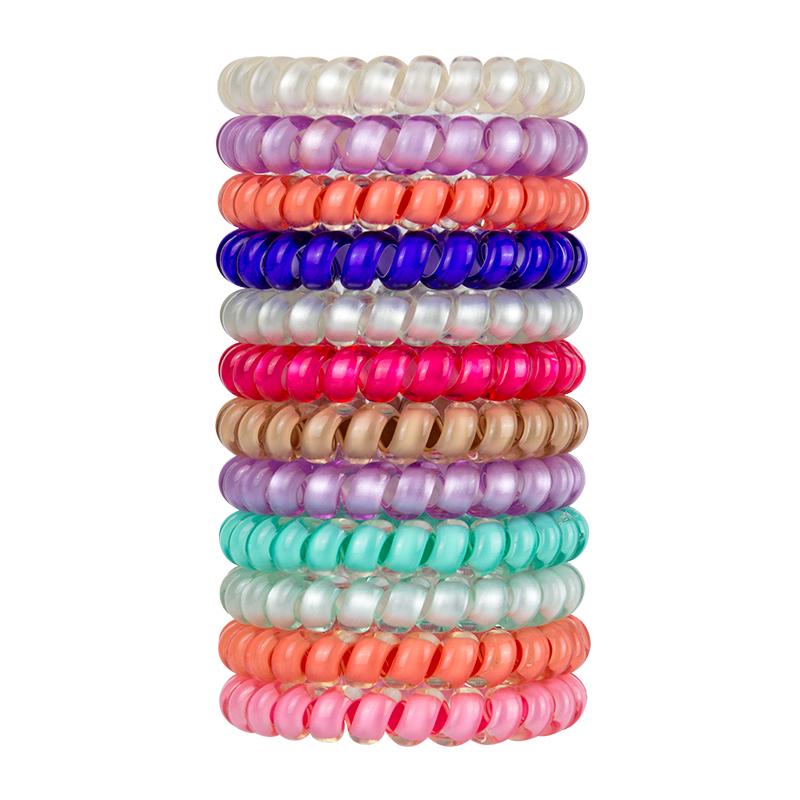 a stack of bright color small swirlydo hair ties on a white backgound
