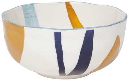 side view of the large canvas stamped bowl with white, yellow, and dark blue colors