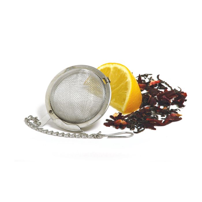 mesh tea infuser next to lemon wedge and loose tea.