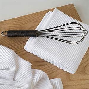 dishtowel on counter with whisk.