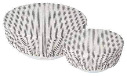 2 off-white bowl covers with dark grey stripes.