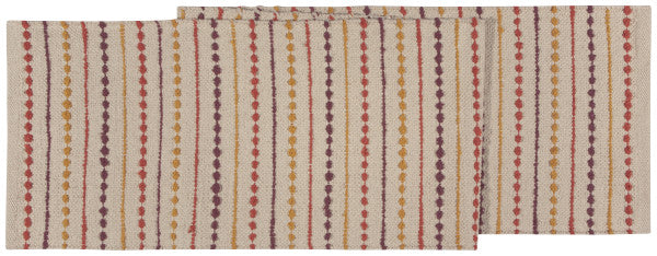 cream table runner with yellow orange and purple stripes.