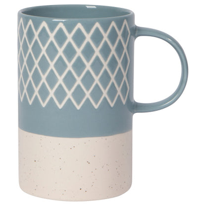 blue mug with exposed terracotta base and criss-cross line pattern.