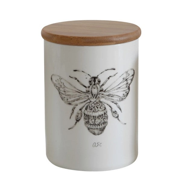 bee canister with bamboo lid on a white background