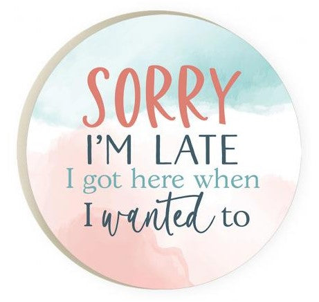 sorry i'm late car coaster has water color in blue and pink with text in pink, dark blue, and light blue displayed on a white background