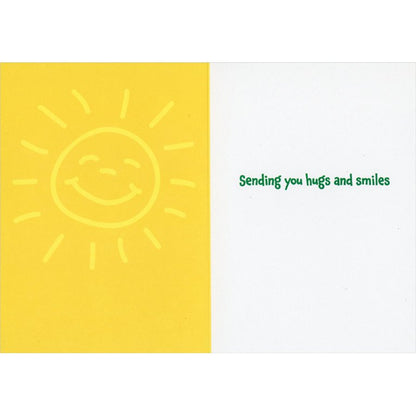 left inside view of card is yellow with a smiling sun and right side is white with green text