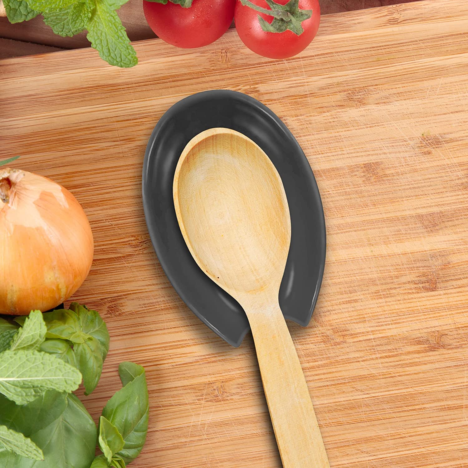 spoon rest with wooden spoon on it.
