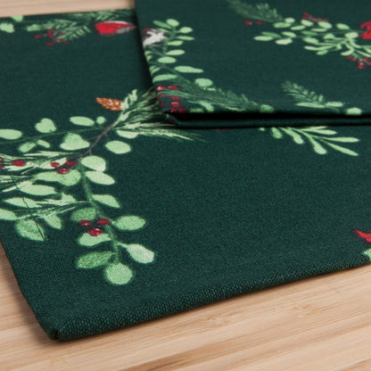 close up view of the forest birds table runner folded over on a light wooden surface