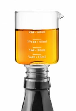 the whiskey jigger stopper on a bottle on a white background