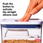 hand pushing button on pop container with text "push button to activate the airtight silicone seal".